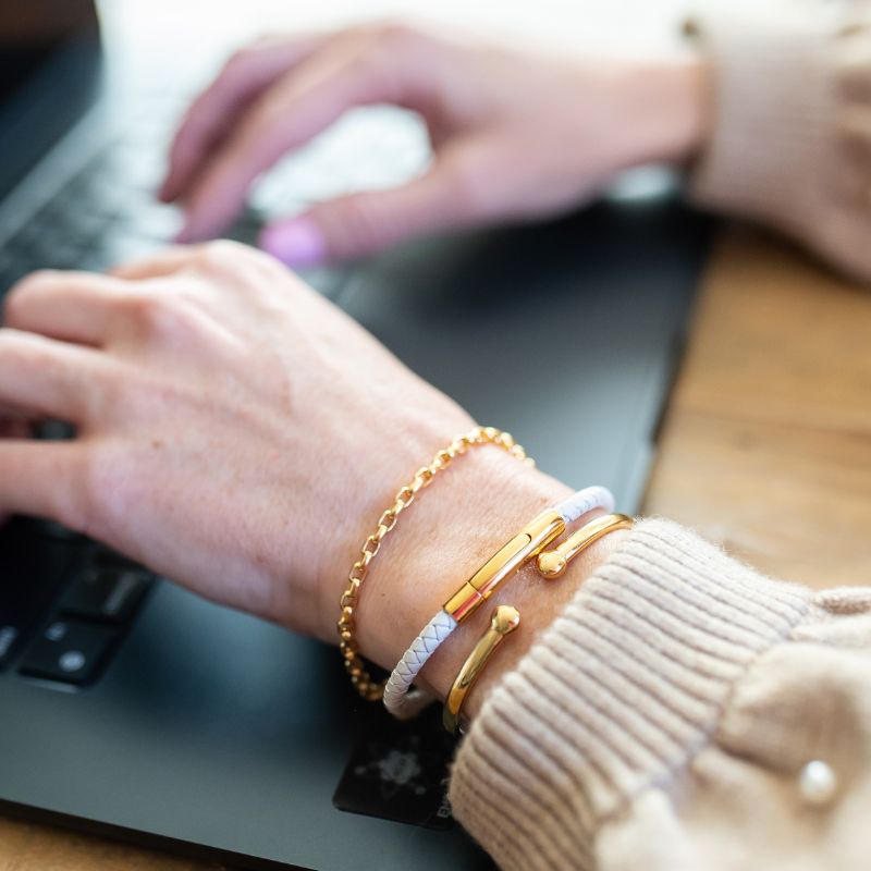 white leather and gold clasp health bracelet